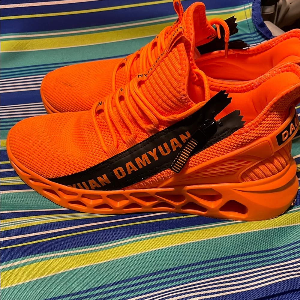 Vibrant Orange Athletic Shoes with Breathable Upper and Cushioned Midsole